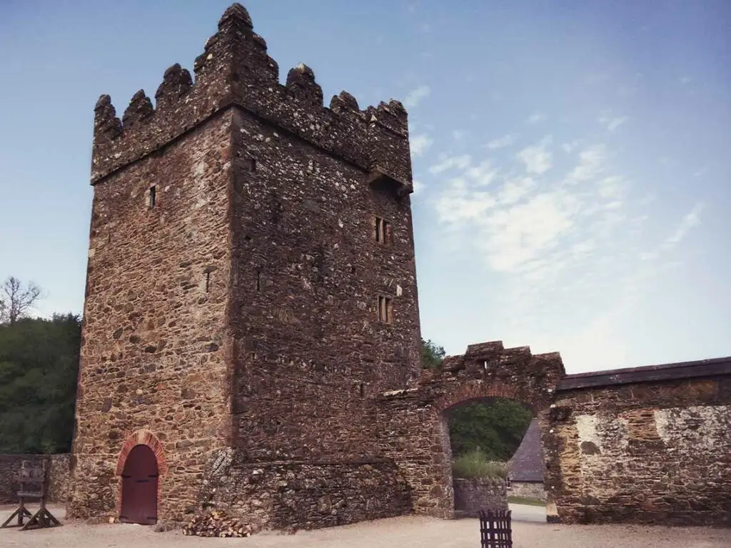 Medieval stone tower and courtyard at Castle Ward estate in Northern Ireland, famous Game of Thrones Winterfell filming location and popular tourist attraction in Ireland