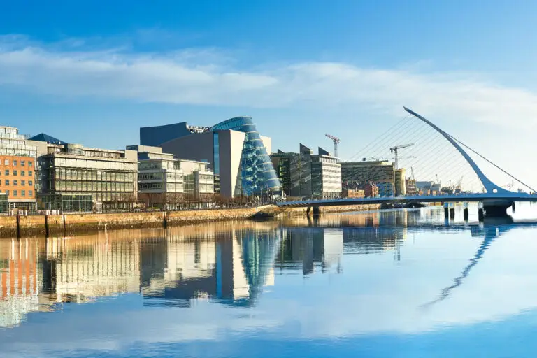 Modern architecture and Samuel Beckett Bridge reflecting on the River Liffey in Dublin, Ireland