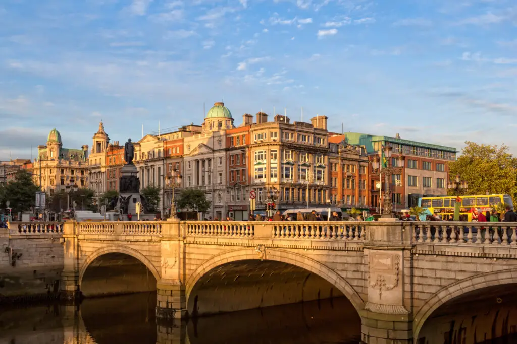 O'Connell Street Dublin cityscape with historic architecture, bridge, and River Liffey at sunset, popular tourist attraction in Ireland