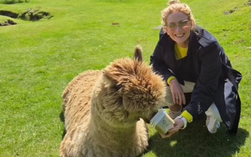A tourist enjoying feeding the animals on her private tour. 